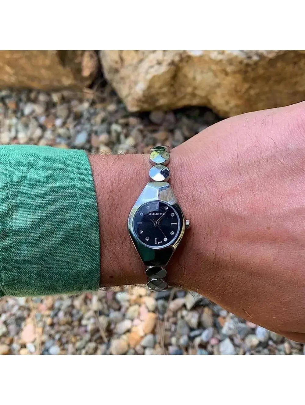Black and silver watch with a unique design with rhinestones